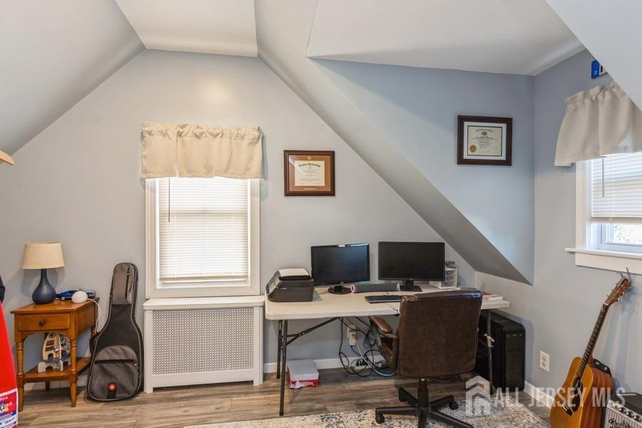 115 Midfield Road Colonia, NJ 07067 - Photo 18 of 25 a view of a workspace with furniture and a window