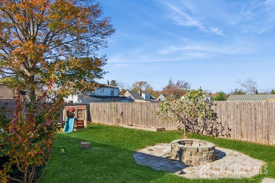 115 Midfield Road Colonia, NJ 07067 - Photo 23 of 25 a view of a backyard with a garden and entertaining space