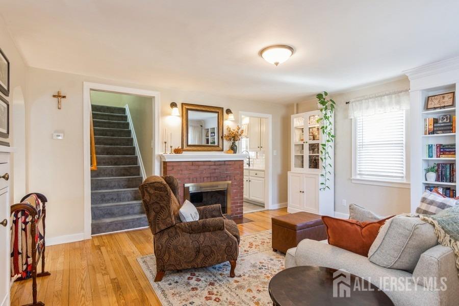 115 Midfield Road Colonia, NJ 07067 - Photo 4 of 25 a living room with furniture and a fireplace