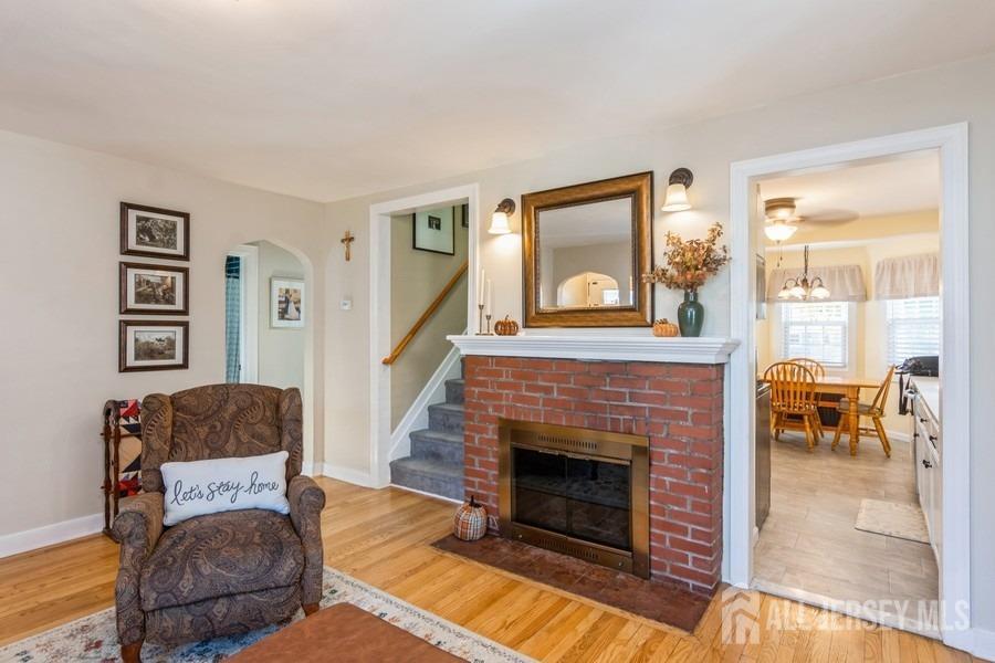 115 Midfield Road Colonia, NJ 07067 - Photo 6 of 25 a living room with furniture and a fireplace