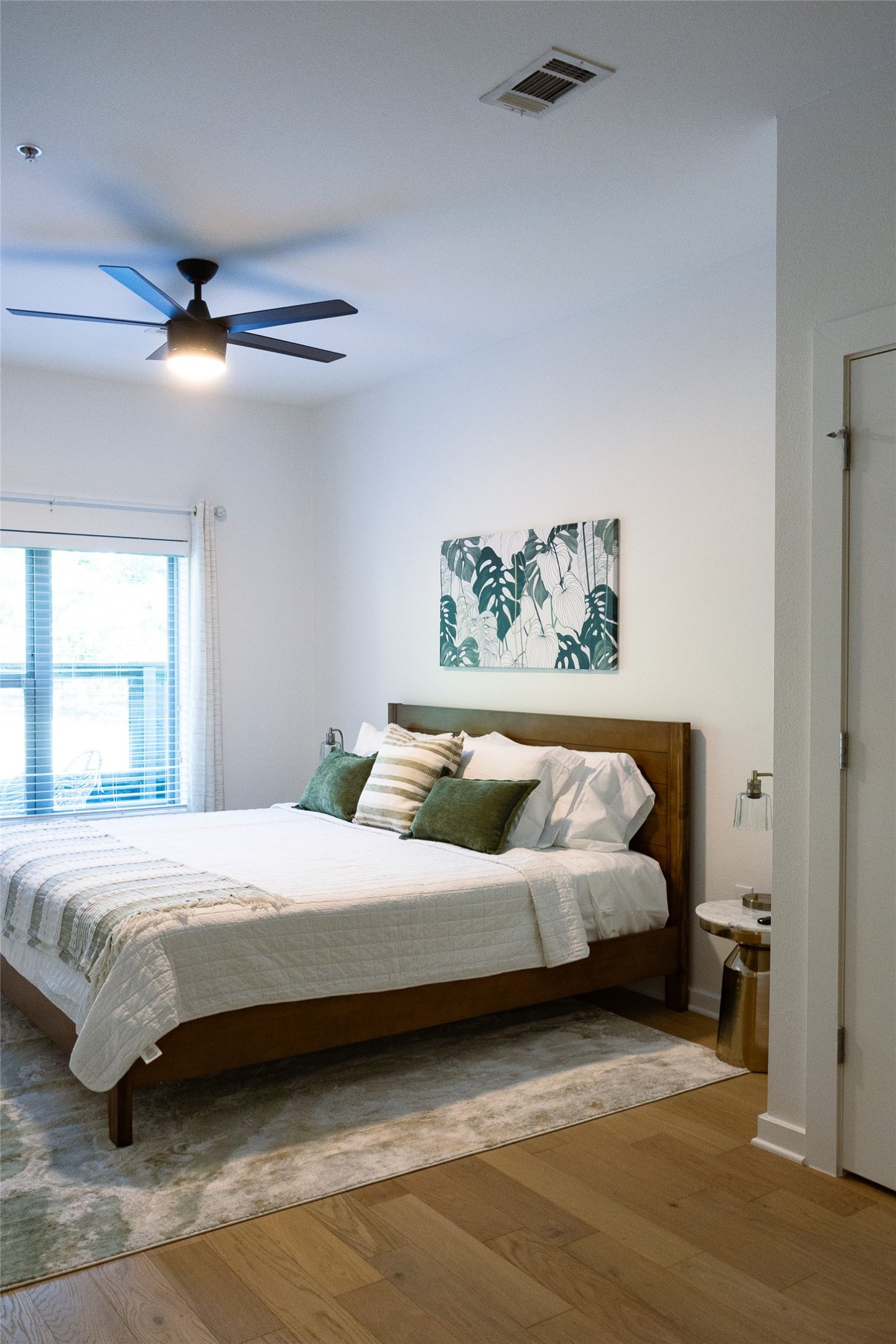 2505 Thornton Road, Unit 3108 Austin, TX 78704 - Photo 17 of 32 a bedroom with a bed and a chandelier