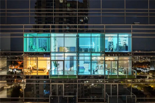 a room with lots of windows and a glass door