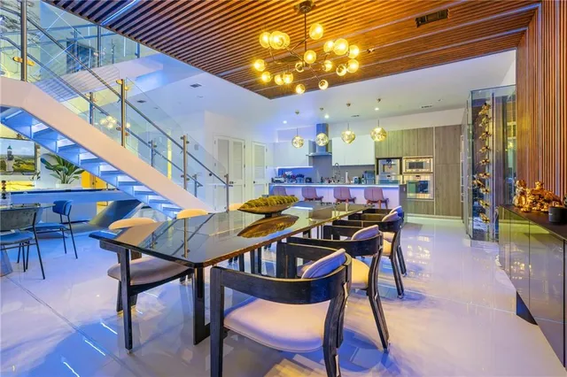 a dining room with furniture and wooden floor