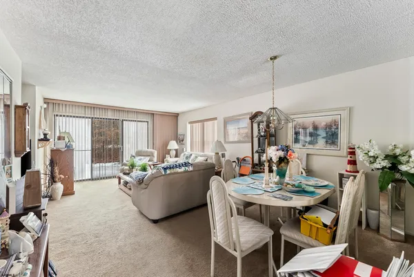 a view of a dining room with furniture window and outside view