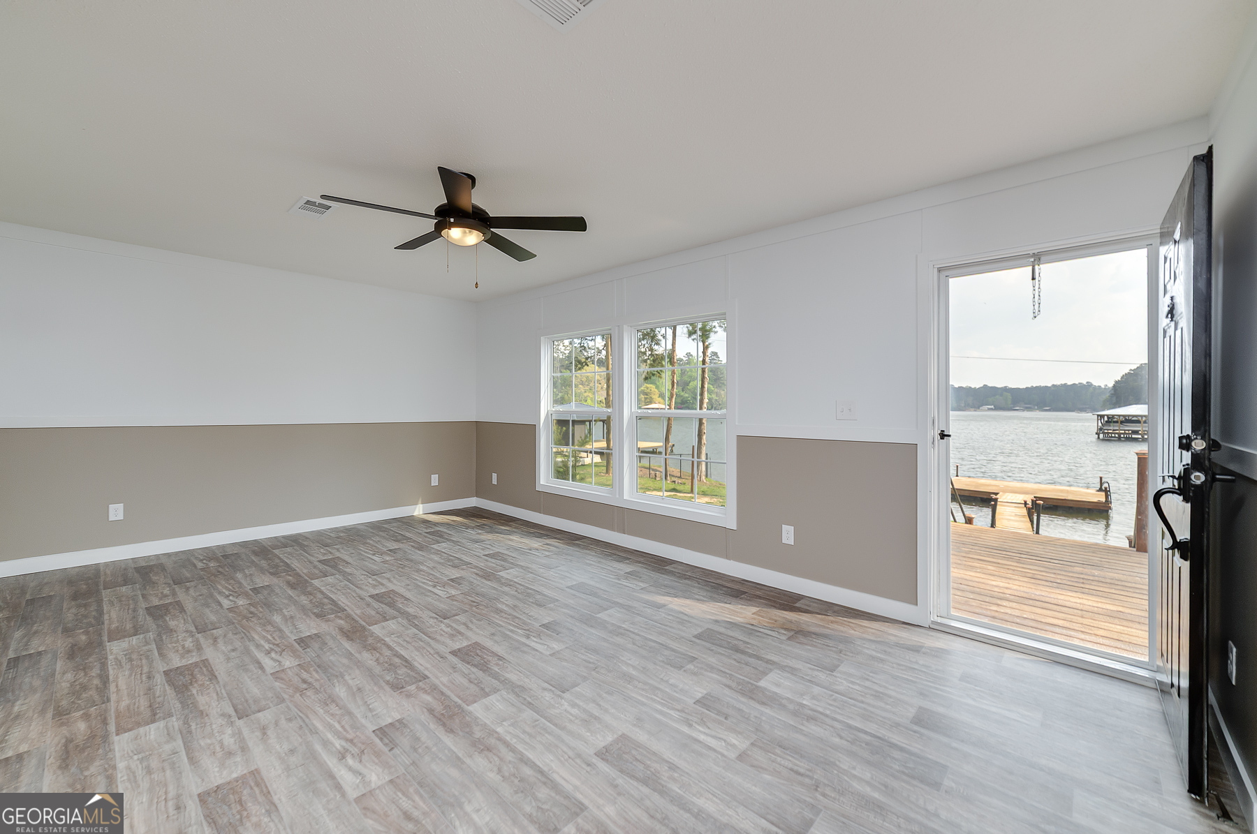 595 Barnetts Bridge Road Jackson, GA 30233 - Photo 13 of 47 wooden floor in an empty room with a window