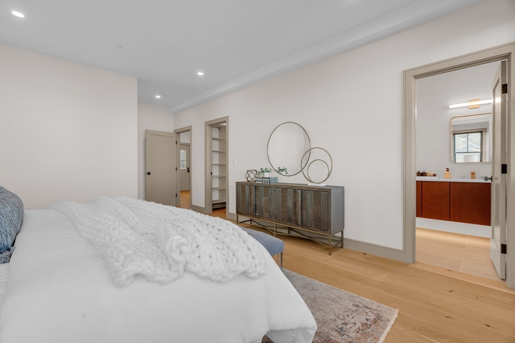 151 Mason Terrace, Unit 2 Brookline, MA 02446 - Photo 11 of 21 a bedroom with a bed and a dresser