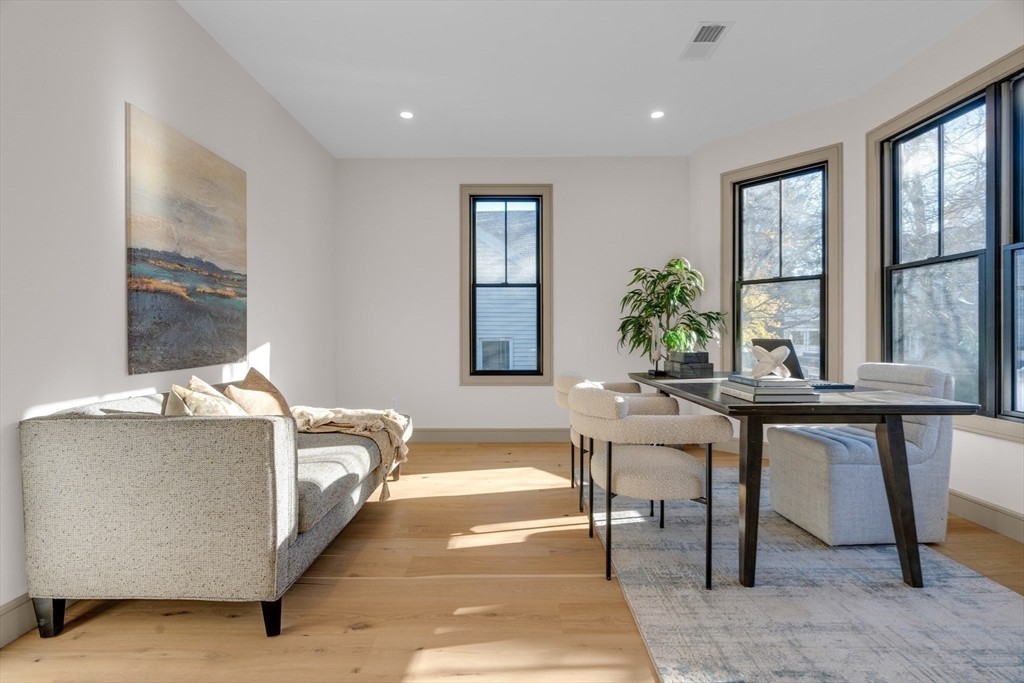 151 Mason Terrace, Unit 2 Brookline, MA 02446 - Photo 13 of 21 a living room with a large window and furniture