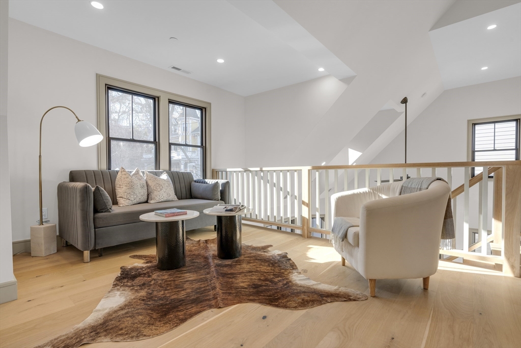 151 Mason Terrace, Unit 2 Brookline, MA 02446 - Photo 16 of 21 a living room with furniture and a window