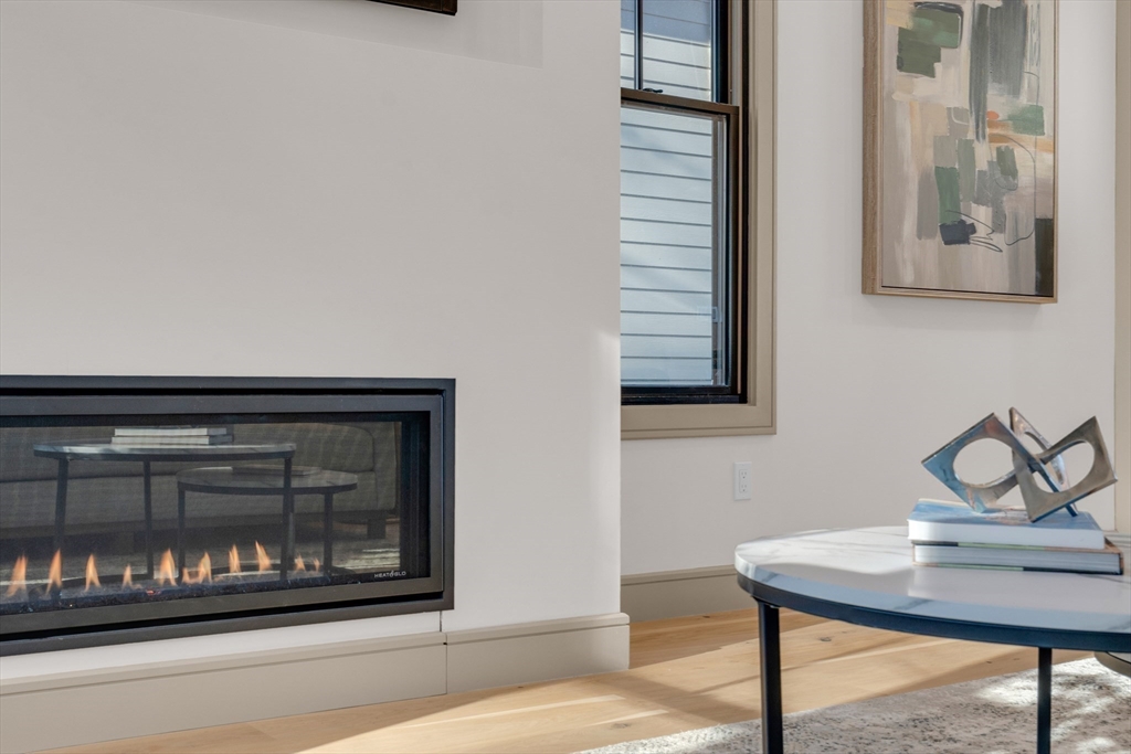151 Mason Terrace, Unit 2 Brookline, MA 02446 - Photo 4 of 21 a view of a livingroom with furniture and window