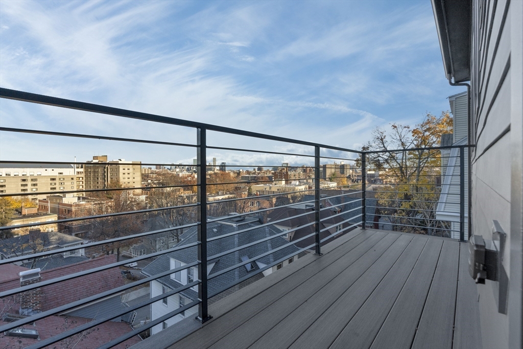 151 Mason Terrace, Unit 2 Brookline, MA 02446 - Photo 9 of 21 a view of a room with wooden floor