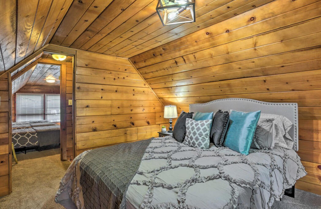42036 Tollhouse Road Shaver Lake, CA 93664 - Photo 20 of 30 a bed sitting in a bedroom next to a window