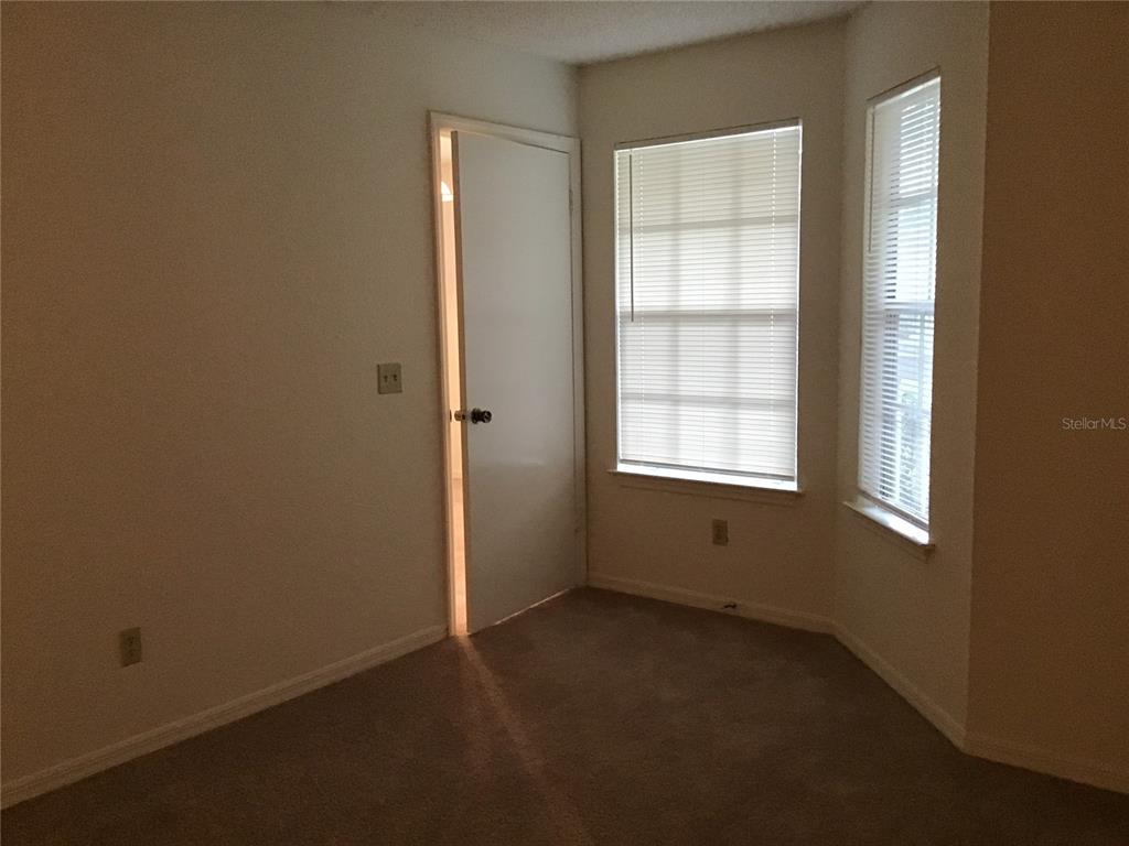 1029 South Hiawassee Road, Unit 2412 Orlando, FL 32835 - Photo 12 of 20 an empty room with windows