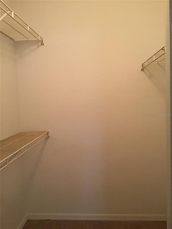 1029 South Hiawassee Road, Unit 2412 Orlando, FL 32835 - Photo 13 of 20 a view of small space with racks on the wall