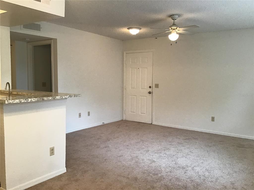 1029 South Hiawassee Road, Unit 2412 Orlando, FL 32835 - Photo 3 of 20 a view of an empty room with a mirror