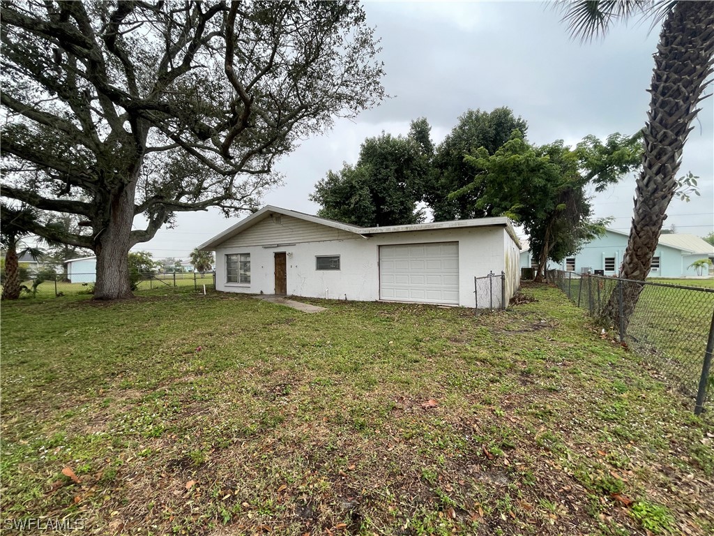 1107 Patterson Road Cape Coral, FL 33909 - Photo 1 of 35 a house view with a backyard space