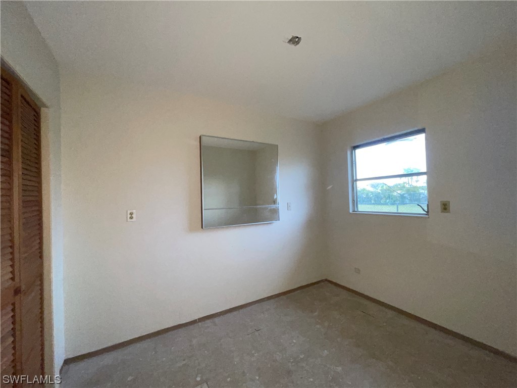 1107 Patterson Road Cape Coral, FL 33909 - Photo 18 of 35 an empty room with a window