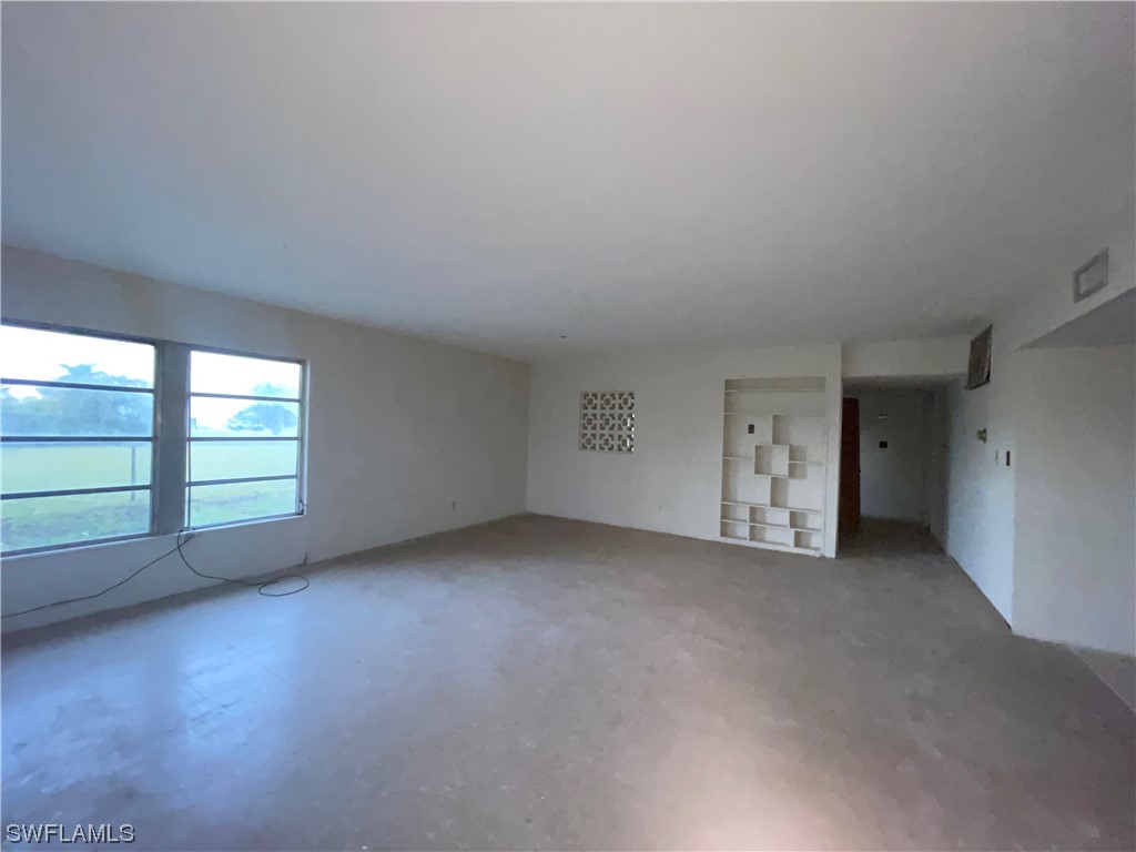 1107 Patterson Road Cape Coral, FL 33909 - Photo 2 of 35 a view of empty room with window