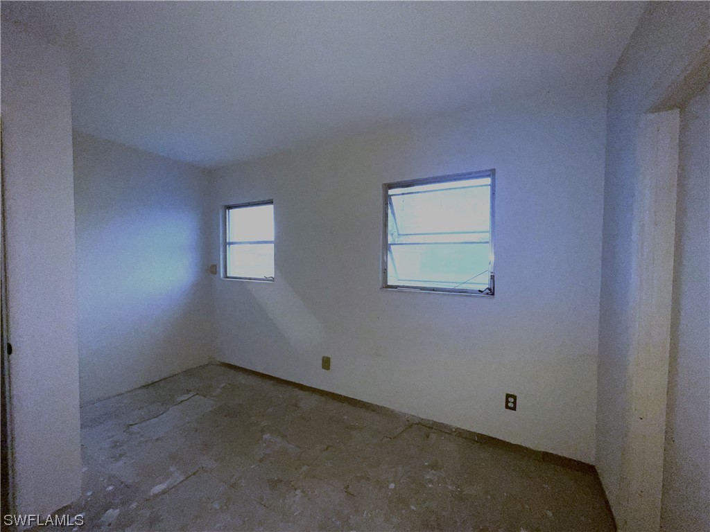 1107 Patterson Road Cape Coral, FL 33909 - Photo 24 of 35 an empty room with a window
