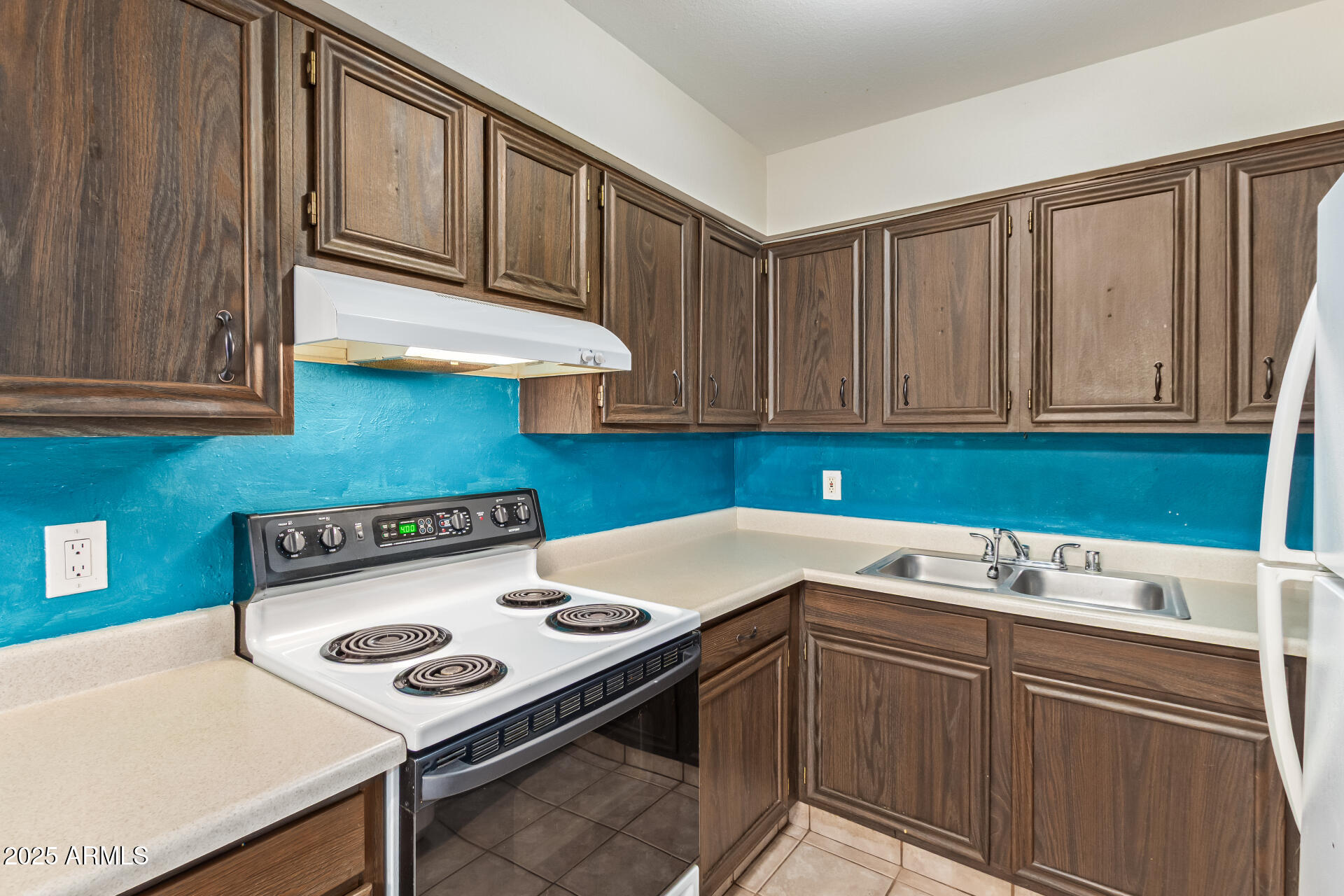 917 South Acapulco Lane, Unit C Tempe, AZ 85288 - Photo 15 of 21 a kitchen with a sink cabinets and appliances