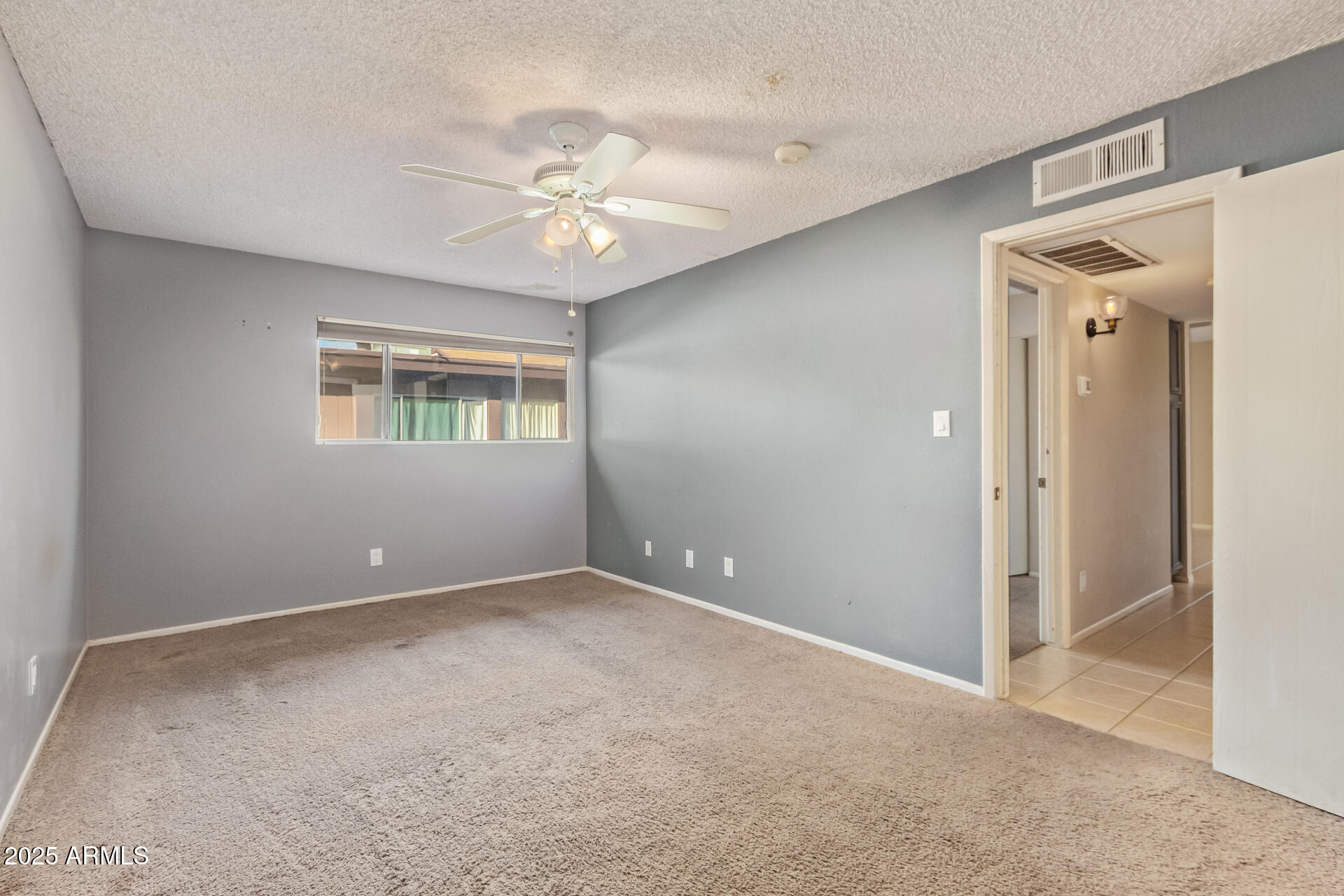 917 South Acapulco Lane, Unit C Tempe, AZ 85288 - Photo 16 of 21 a view of an empty room with a window