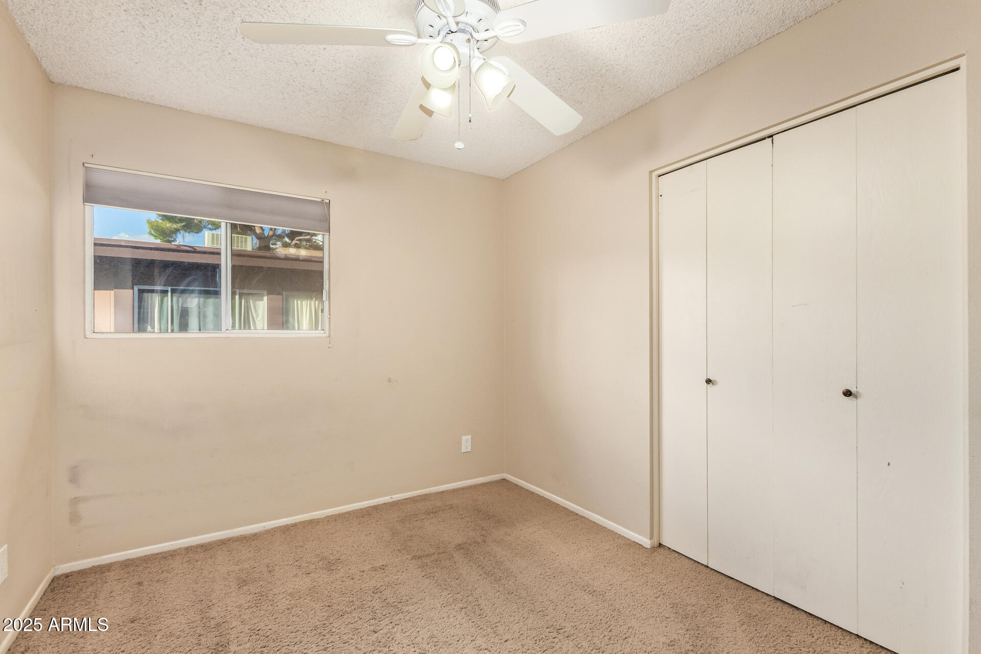 917 South Acapulco Lane, Unit C Tempe, AZ 85288 - Photo 7 of 21 an empty room with a window