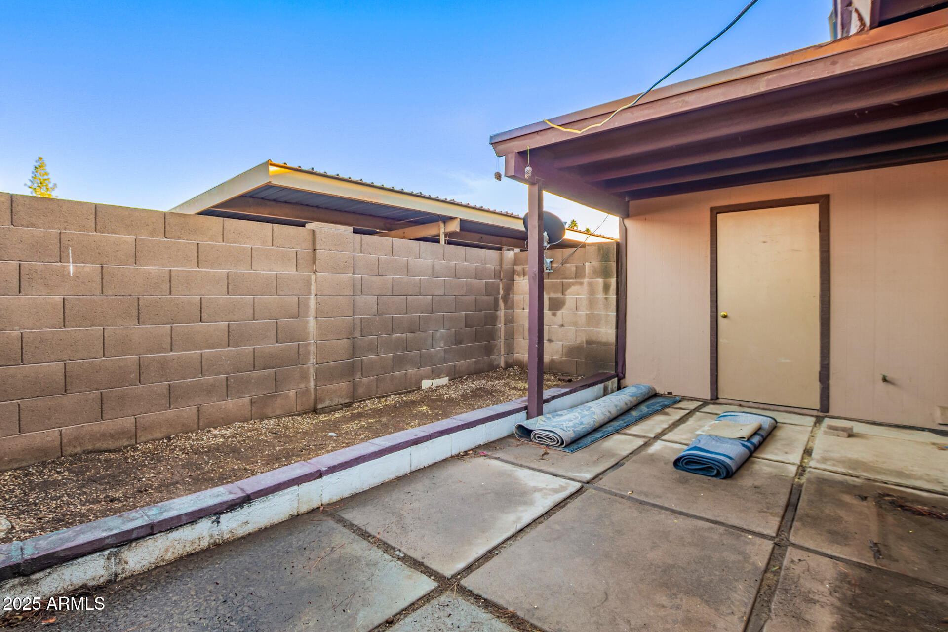917 South Acapulco Lane, Unit C Tempe, AZ 85288 - Photo 8 of 21 a view of a backyard with a chair and table in the patio