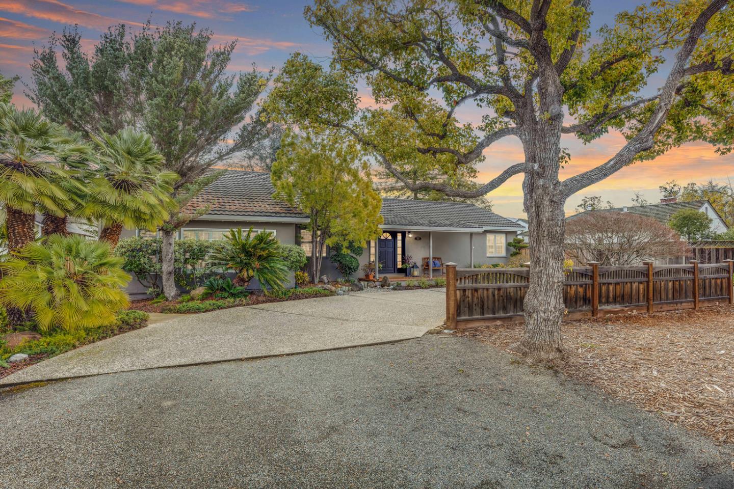1570 Walnut Drive Campbell, CA 95008 - Photo 2 of 68 front view of house with table and chairs under an large tree