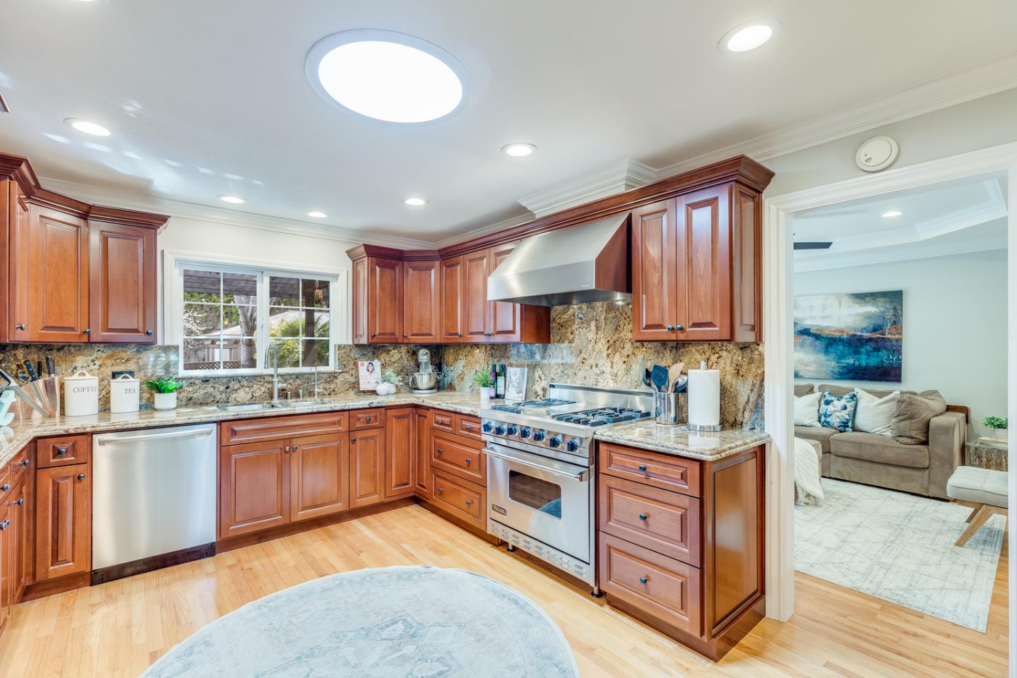 1570 Walnut Drive Campbell, CA 95008 - Photo 23 of 68 a kitchen with stainless steel appliances granite countertop a stove top oven a sink dishwasher and cabinets with wooden floor