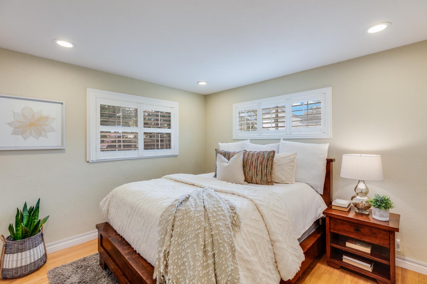 1570 Walnut Drive Campbell, CA 95008 - Photo 54 of 68 a bedroom with a bed and a potted plant