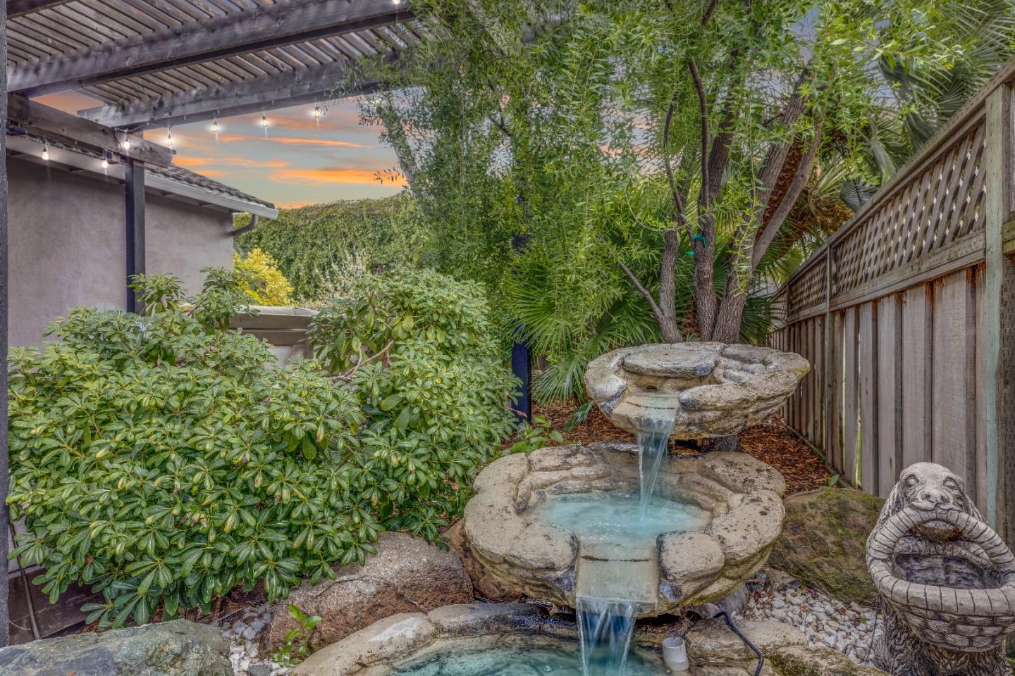 1570 Walnut Drive Campbell, CA 95008 - Photo 62 of 68 a view of a backyard with table and chairs and potted plants