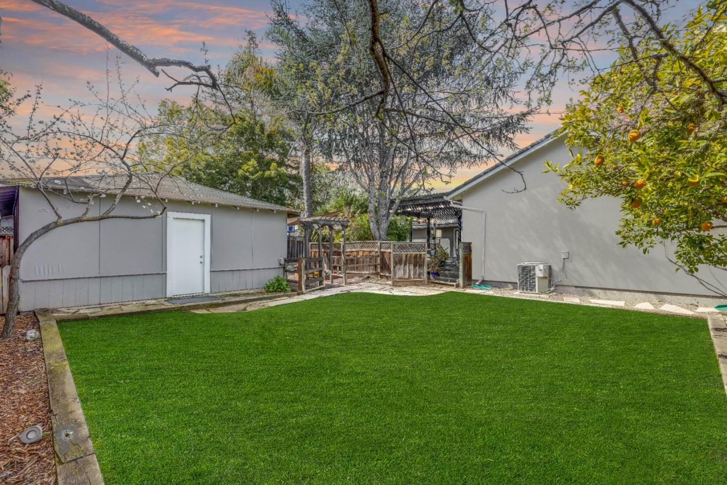 1570 Walnut Drive Campbell, CA 95008 - Photo 64 of 68 a backyard of a house with table and chairs and potted plants