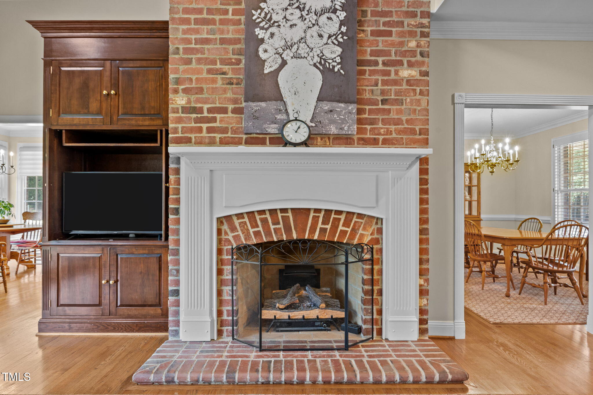 5405 Carbonton Road Sanford, NC 27330 - Photo 12 of 63 a living room with furniture a flat screen tv and a fireplace