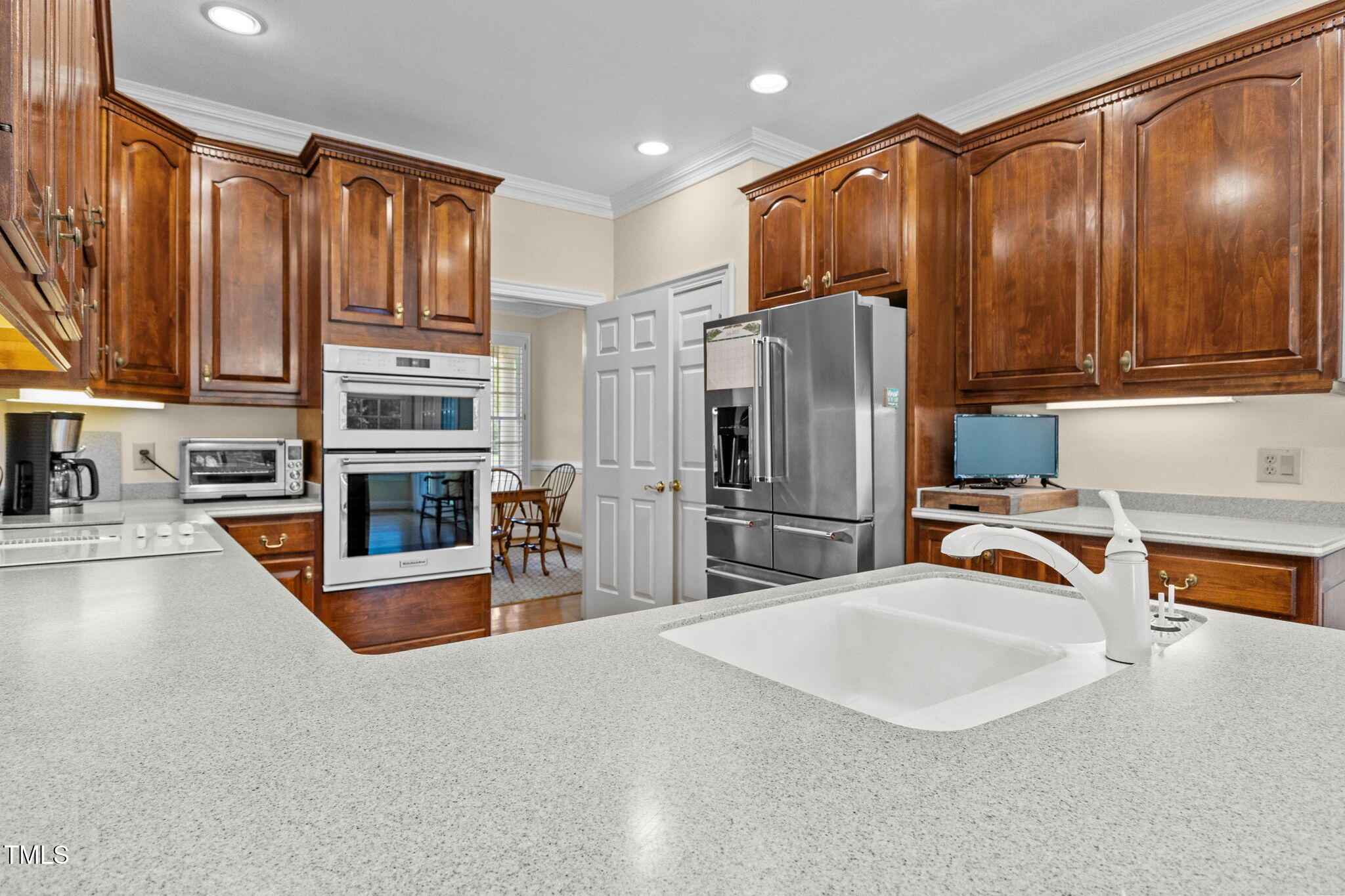 5405 Carbonton Road Sanford, NC 27330 - Photo 18 of 63 a kitchen with stainless steel appliances granite countertop a refrigerator and a sink