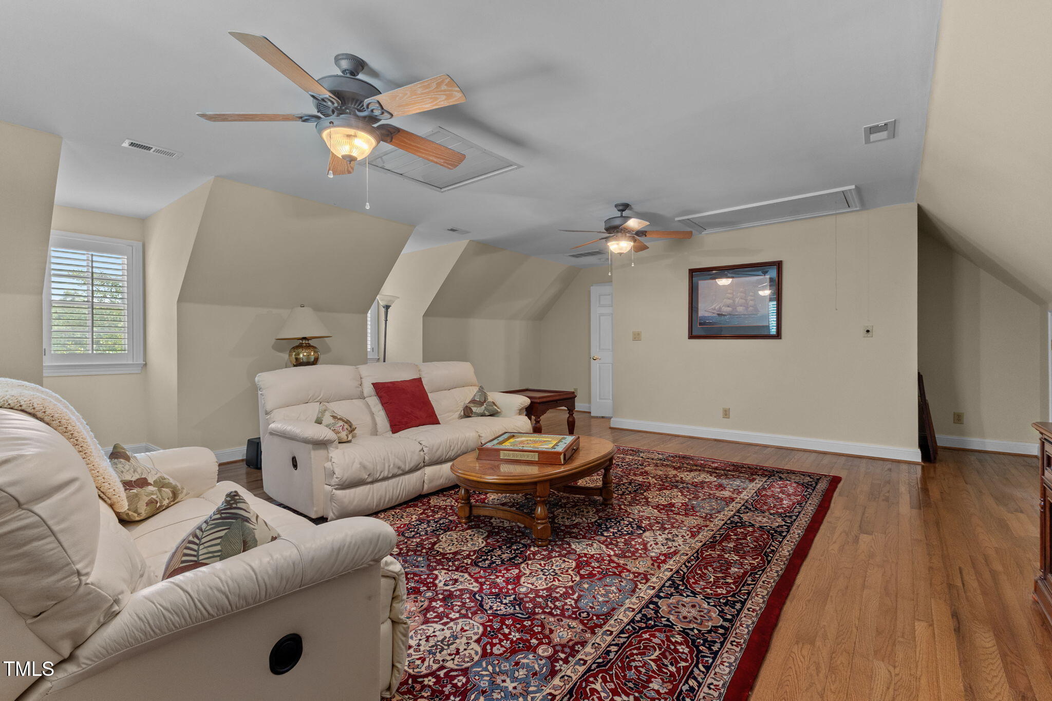 5405 Carbonton Road Sanford, NC 27330 - Photo 24 of 63 a living room with furniture and a wooden floor