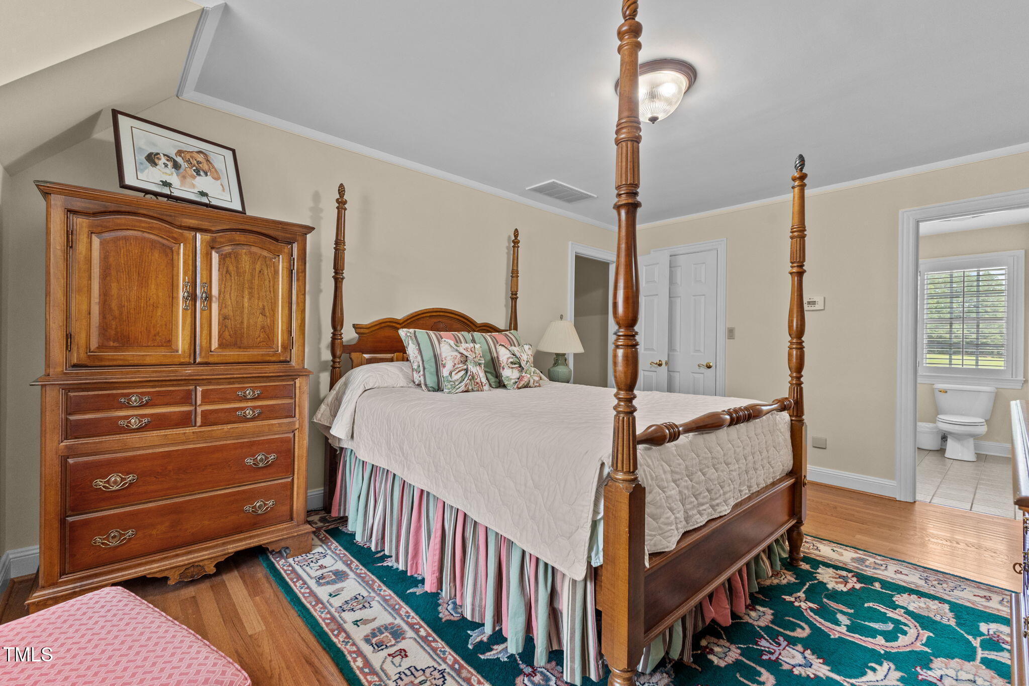 5405 Carbonton Road Sanford, NC 27330 - Photo 26 of 63 a bedroom with a bed and wooden floor