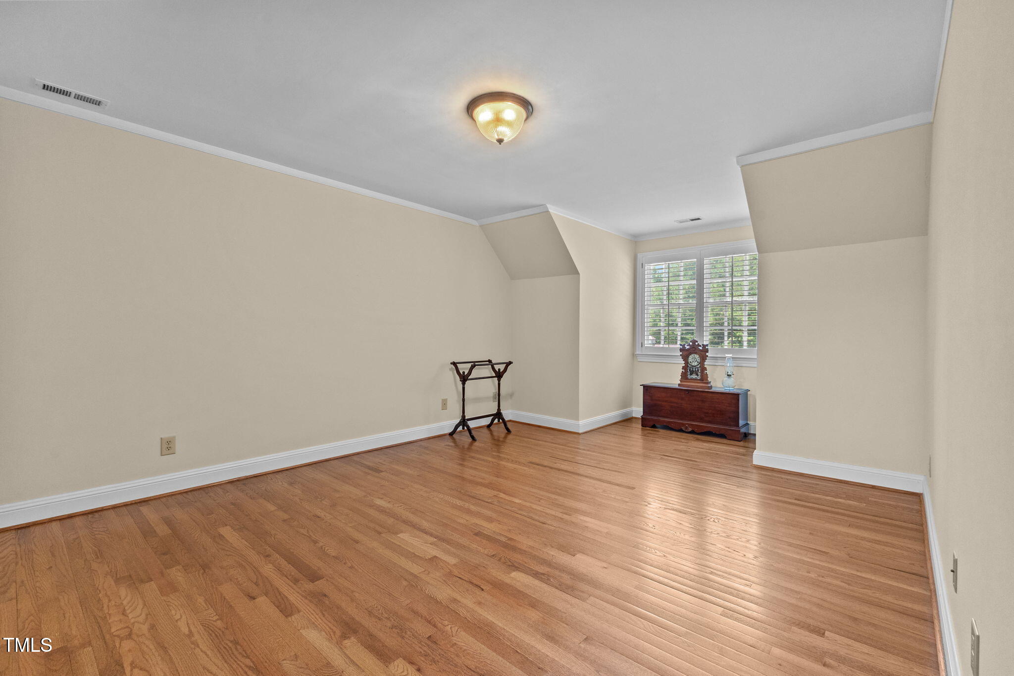5405 Carbonton Road Sanford, NC 27330 - Photo 28 of 63 a view of an empty room with wooden floor and a window