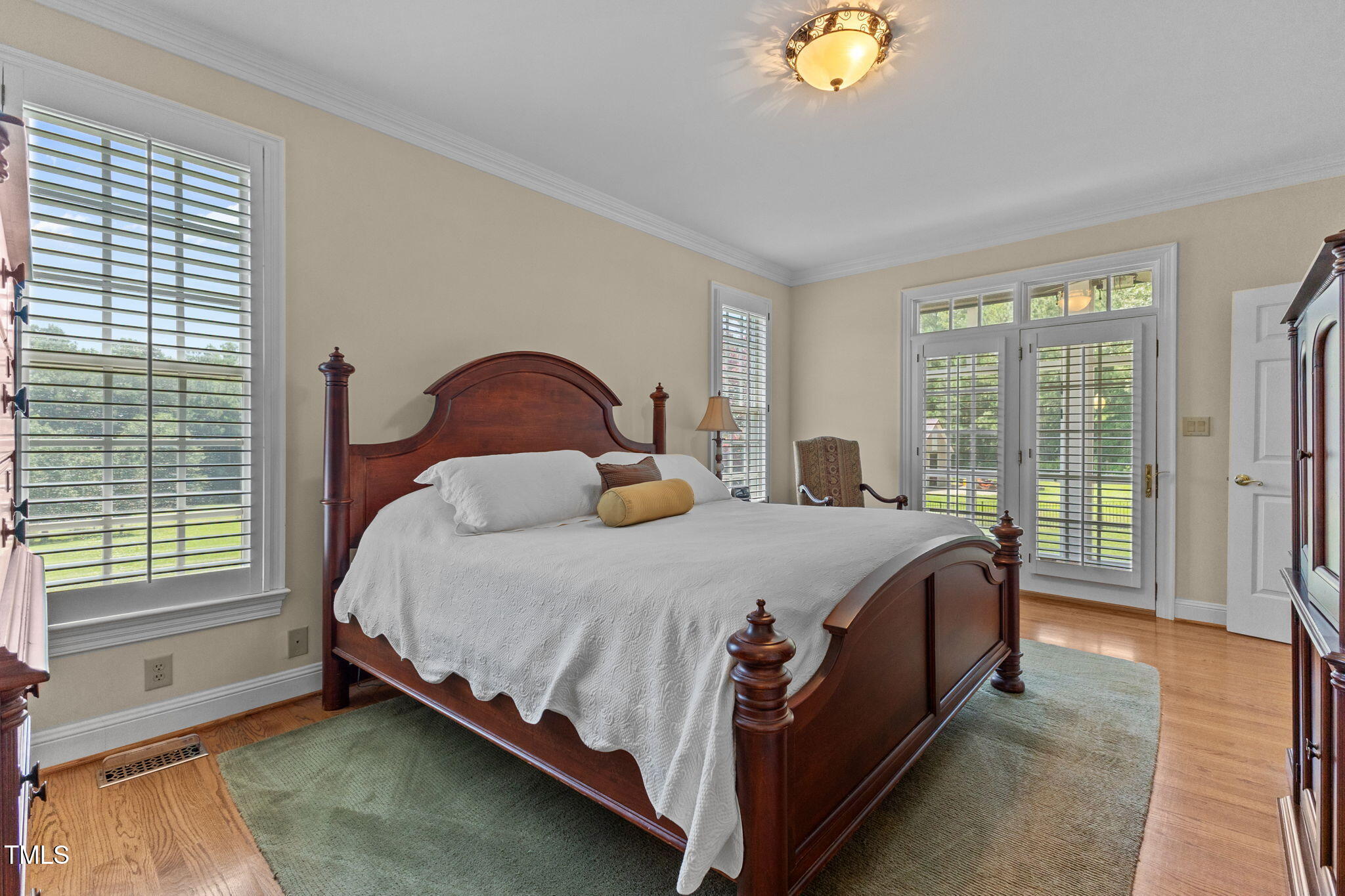 5405 Carbonton Road Sanford, NC 27330 - Photo 35 of 63 a bed sitting in a bedroom next to a window