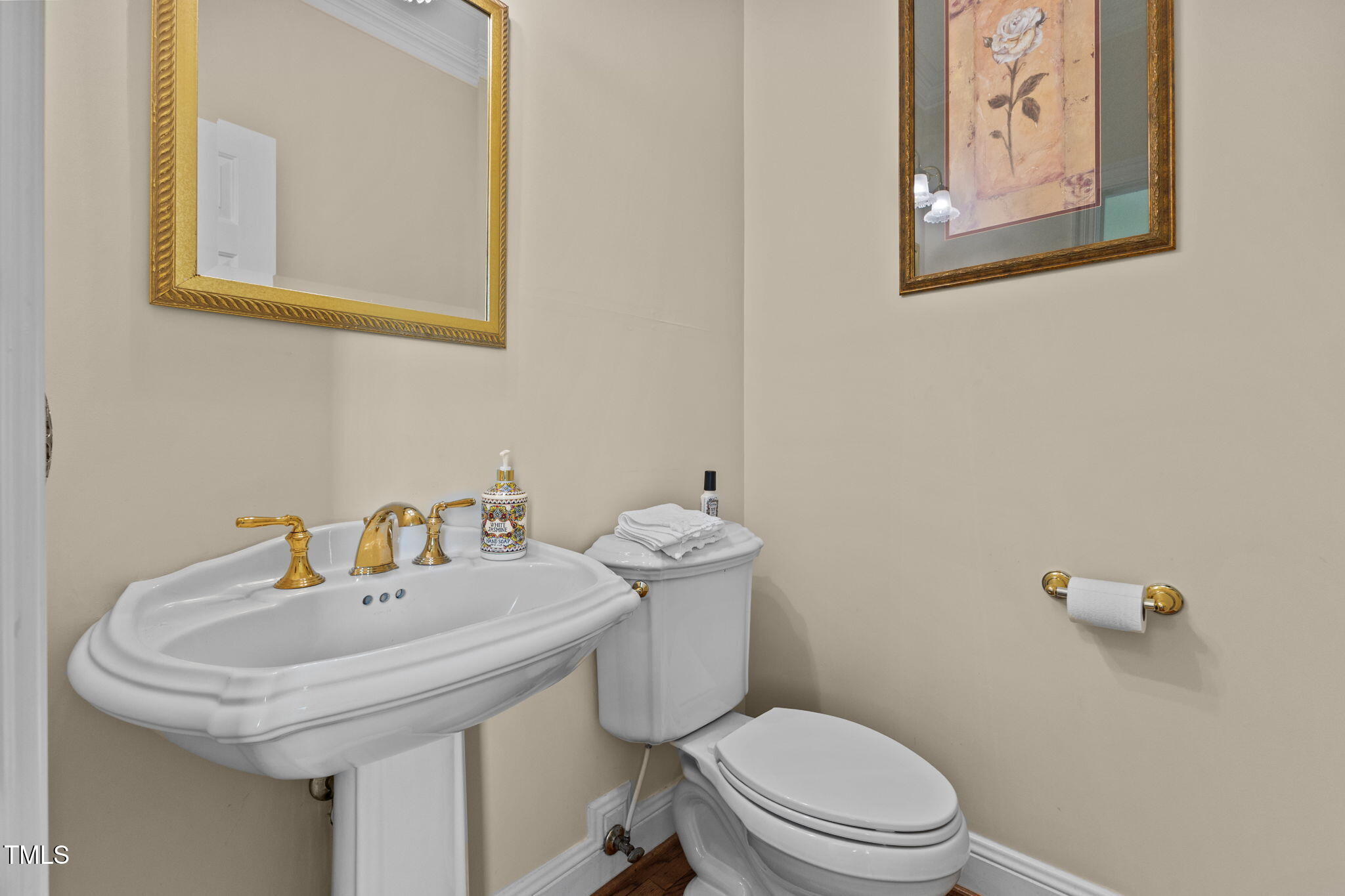 5405 Carbonton Road Sanford, NC 27330 - Photo 38 of 63 a bathroom with a toilet a sink and mirror