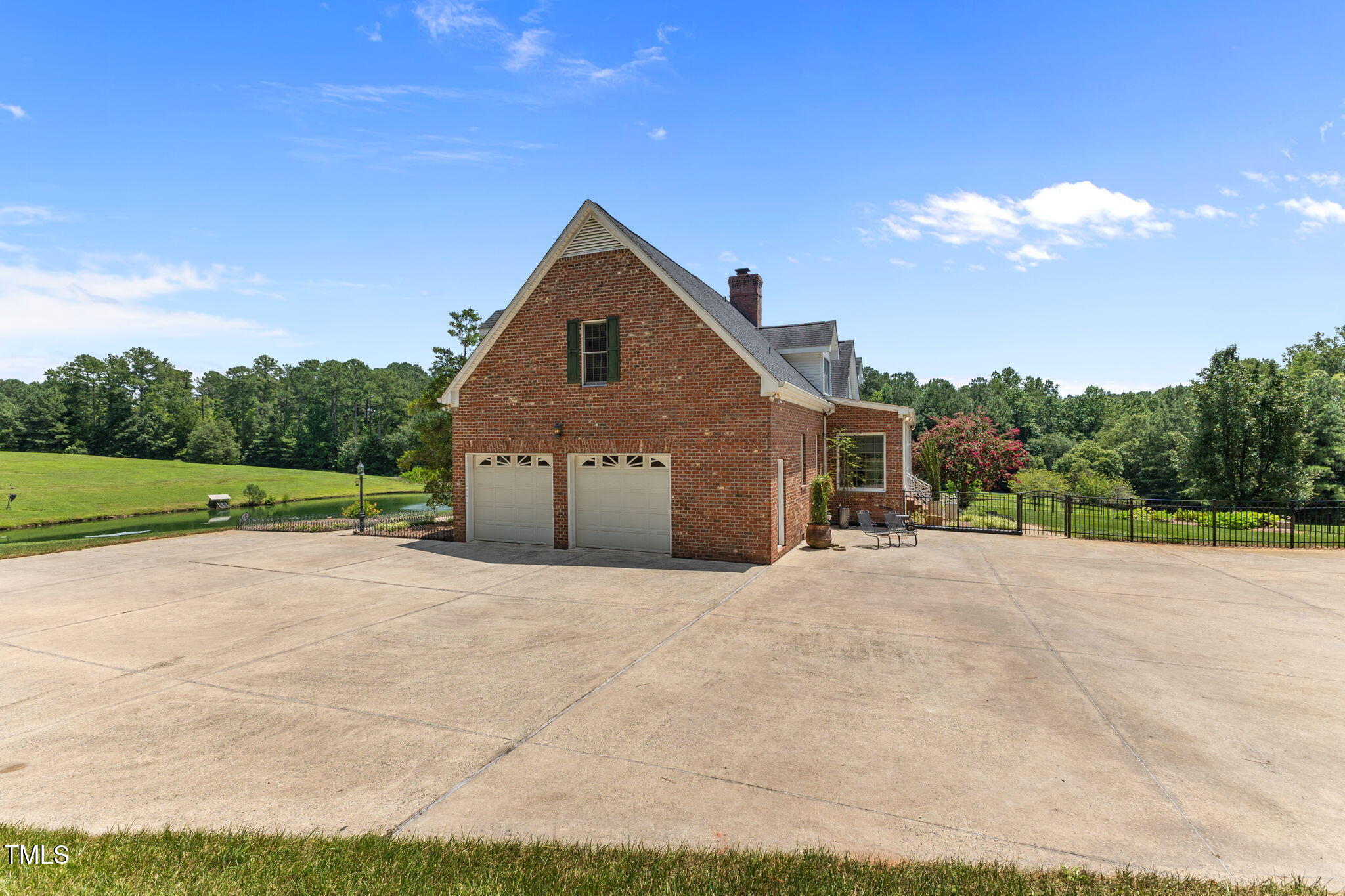 5405 Carbonton Road Sanford, NC 27330 - Photo 39 of 63 a front view of a house with a yard and garage