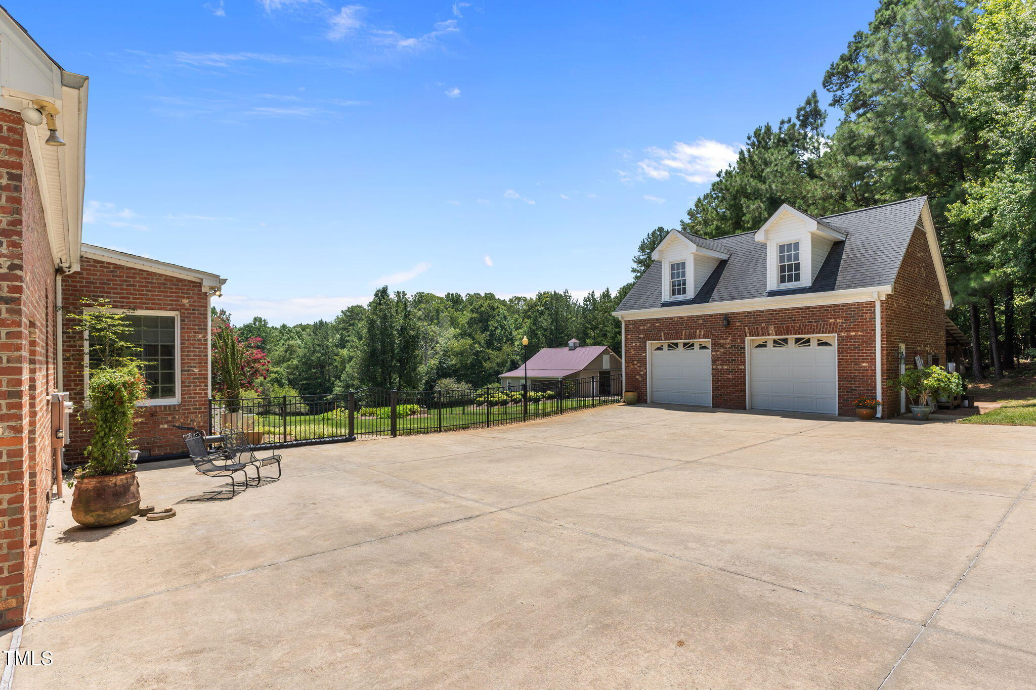 5405 Carbonton Road Sanford, NC 27330 - Photo 42 of 63 a wooden bench sitting in front of a building