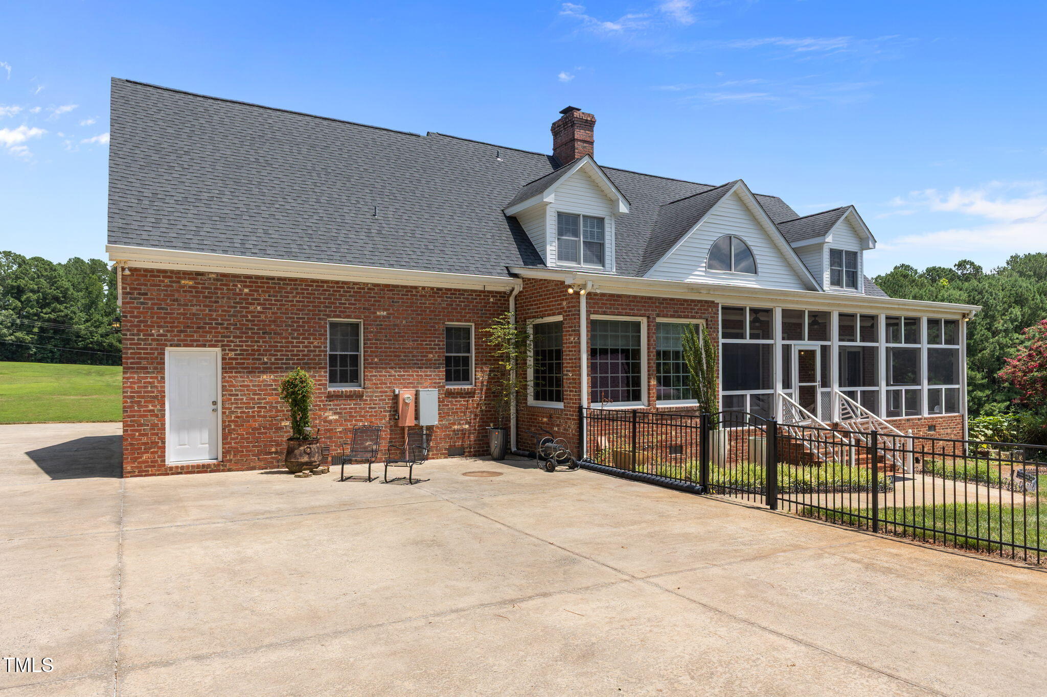5405 Carbonton Road Sanford, NC 27330 - Photo 49 of 63 a view of a house with backyard porch and sitting area