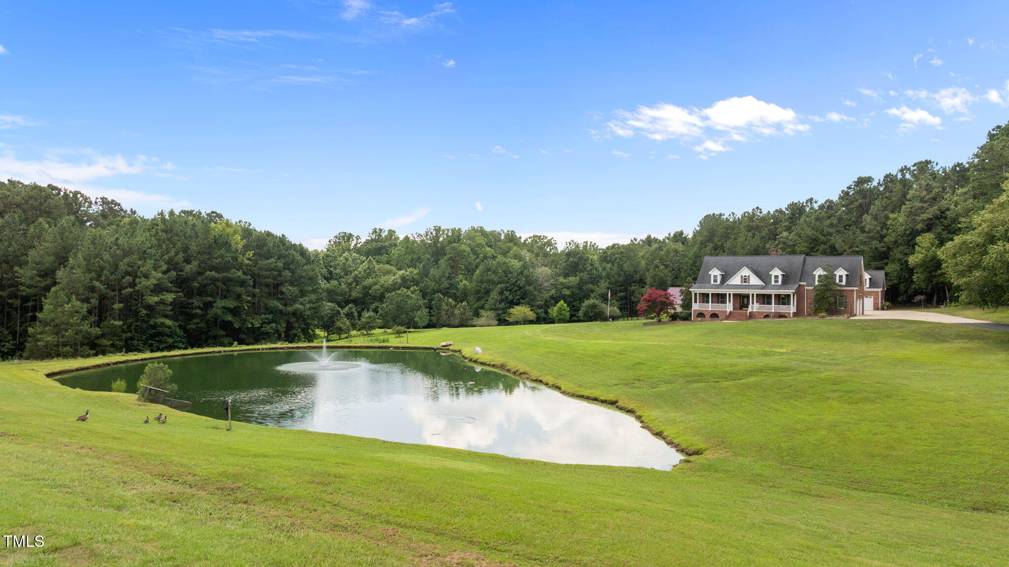 5405 Carbonton Road Sanford, NC 27330 - Photo 55 of 63 a view of a swimming pool and trees in the background