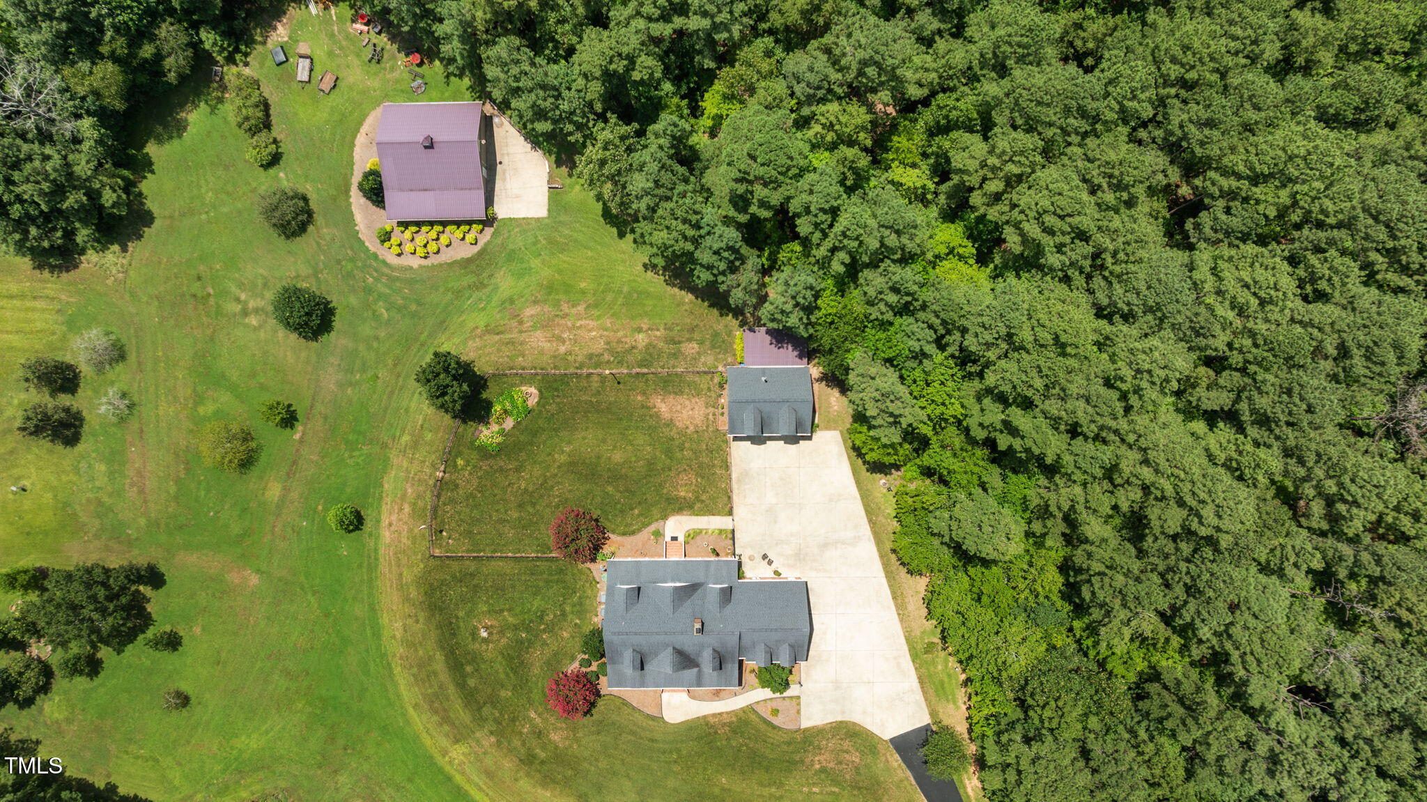 5405 Carbonton Road Sanford, NC 27330 - Photo 60 of 63 an aerial view of a house with a yard