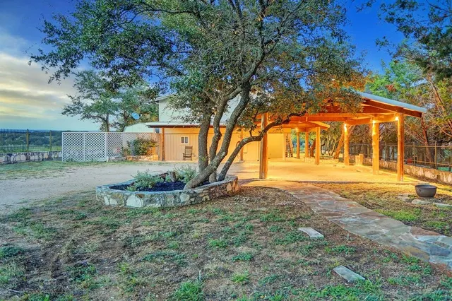 a view of a backyard with sitting area
