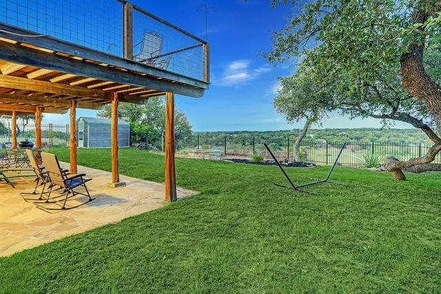 a view of a backyard with a garden and plants