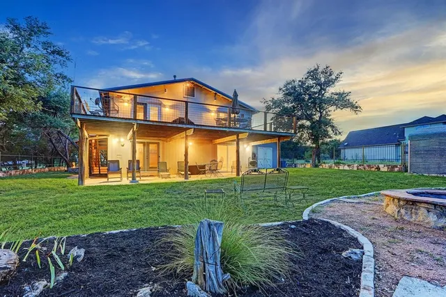 a kitchen with a sink a counter top space stainless steel appliances and cabinets