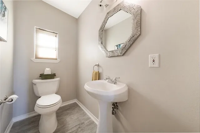 a bed room with a bed and a chandelier