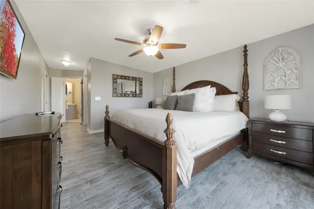 a spacious bathroom with a bathtub shower sink mirror and toilet