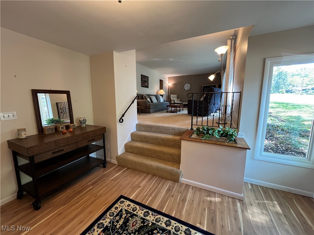 2079 Wyndham Road Akron, OH 44313 - Photo 3 of 35 The living room invites you up the carpeted stairs from the entry foyer with full windows bringing in natural light.