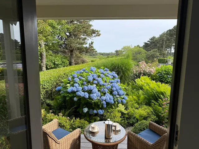 a view of a chair and table in a balcony
